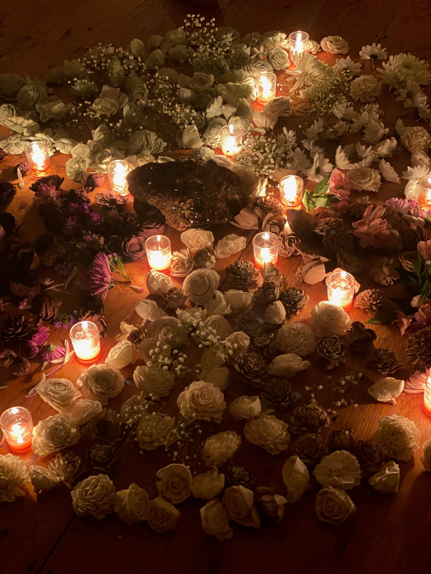 circular flower arrangements,  flowers and candles,  sacred space