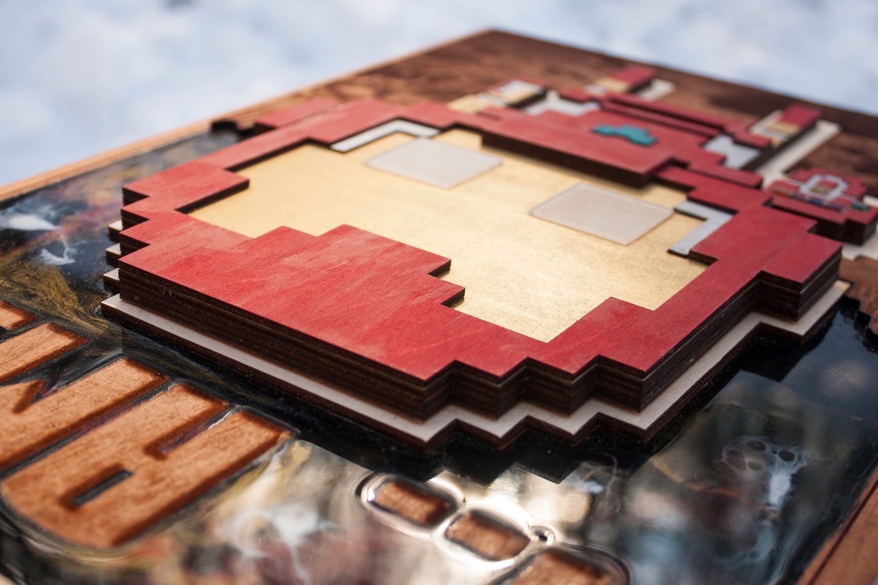 8 bit iron hero with glowing parts, made of wood, resin and acrylic